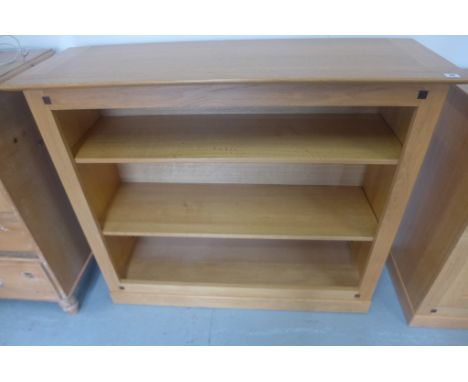 A Multi-York light oak bookcase with two shelves, 118cm W x 100cm H 