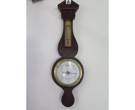 A Victorian oak cased barometer with thermometer by Negratti and Zambra, London - height 61cm 