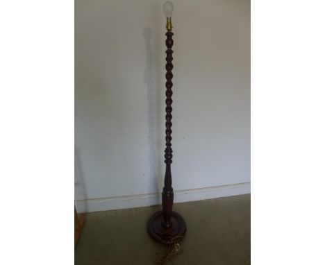 A mid 20th century barley twist mahogany standard lamp, tested and working, 158cm tall, polished condition 