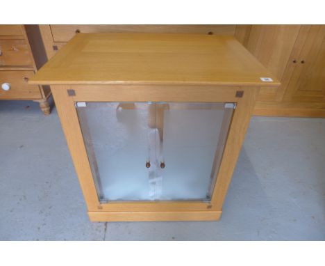 A Multi-York cabinet, light oak with a glass shelf and two glass doors, as new, 70cm W x 76cm H 