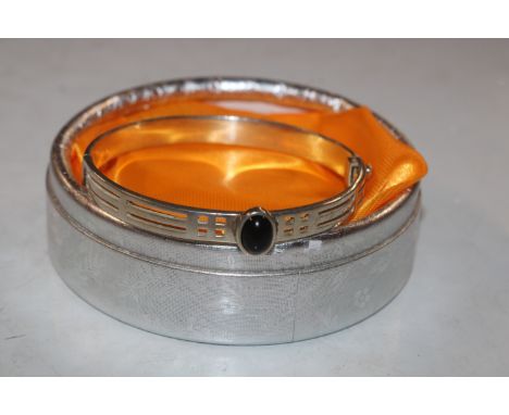 A solid Sterling silver Macintosh style hinged bangle