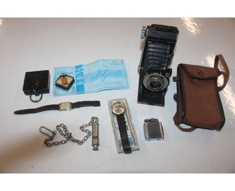 A box containing a Helios folding camera; a military marked compass; a Ronson lighter; a J. Hudson &amp; Co. military marked 