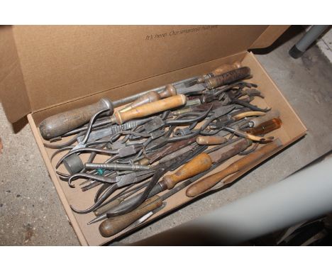 A box of assorted tools to include watchmakers 