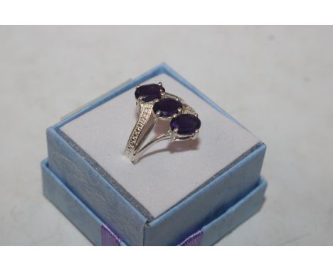 A Sterling silver and amethyst set ring, ring size L/M