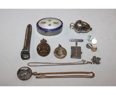 An oval silver and enamel decorated box and cover AF; a silver babies rattle; a pair of cuff-links; and various pendants and 