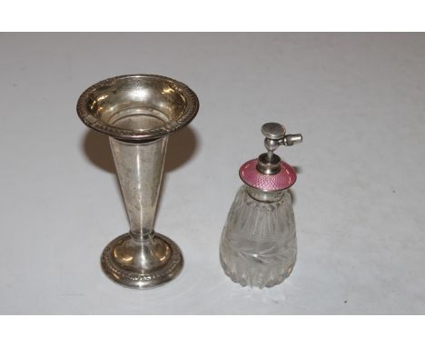 A cut glass Sterling silver and enamel decorated perfume atomiser and a silver spill vase with weighted base