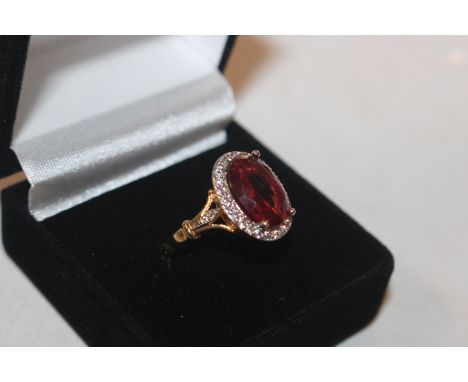 A 925 silver gilt ring set with ruby coloured stones