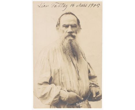 Leo Tolstoy. A postcard photograph portrait, the subject standing with fixed gaze, signed in the upper field 'Leo Tolstoy 19 