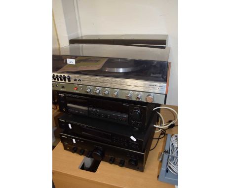 A group of vintage stereo equipment comprising Kenwood KX3030 stereo cassette deck, stereo tuner KT=1030L, Kenwood amplifier 