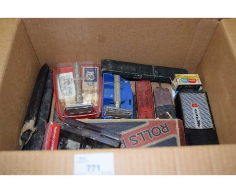 A box of various vintage razors