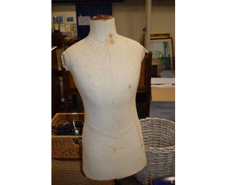 A vintage tailors dummy on tripod mount