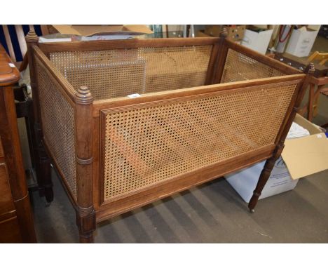 A Victorian hardwood and cane baby cot