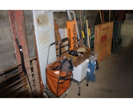 A reproduction advertising crate, a shopping trolley, a step stool, projector screen etc