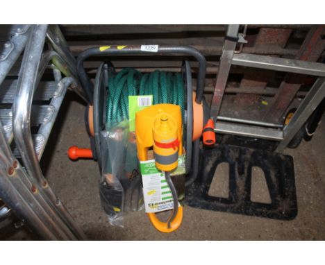 A Hozelock reel and hosepipe, as-new gardening tools, as-new garden sprinkler