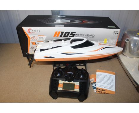 An H105 Water Wizard remote control speedboat with original box and controller with instruction manual 