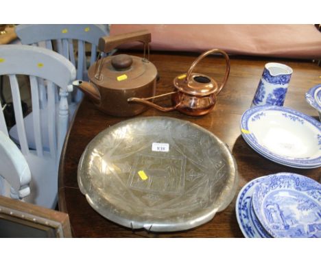 A small copper watering can, copper kettle sold as collectors item, together with a decorated dish