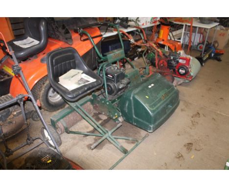 An Atco Royal B24 cylinder mower with electric start and key, instruction book and roller seat