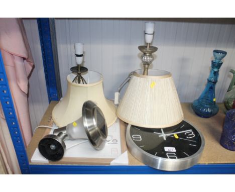 A solar light; two table lamps; a modern wall clock etc.