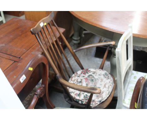 An Ercol stick back rocking chair 