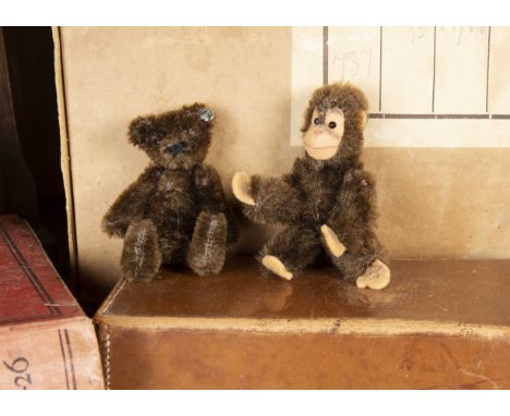 A post-war miniature Steiff Teddy Bear, with brown mohair, black pin eyes, black stitched nose and mouth, swivel head, jointe