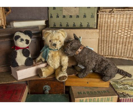 A 1930s British terrier dog and his friends, with black flecked with white wool plush, clear and black glass eyes with brown 