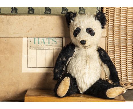 A post-war Chiltern Hugmee Teddy Bear, with black and white mohair, orange and black glass eyes, black felt behind, pronounce