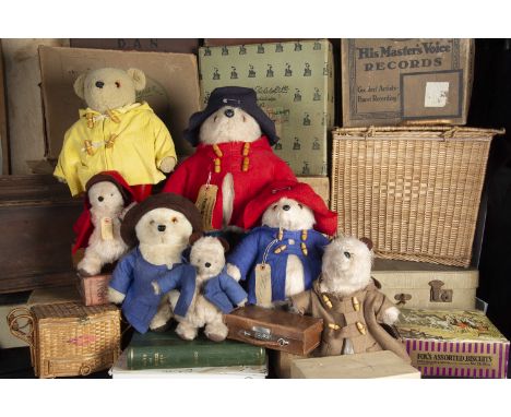 Gabrielle Paddington soft toys, a Paddington with red duffle coat, dark blue hat, blue Dunlop Wellingtons and luggage label —