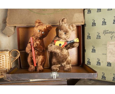 Two post-war Russian clockwork bears,  both with brown artificial silk plush, one playing a balalaika and another with a wood