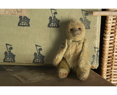 A larger size British WWI soldier Teddy Bear, with blonde mohair, black boot button eyes, black stitched, swivel head and pin