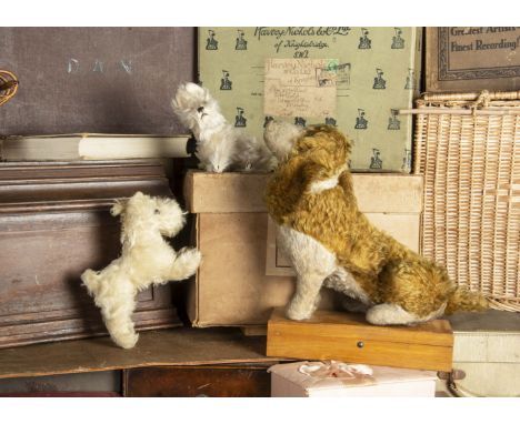 A British seated spaniel dog 1920-30s, with light brown mohair, white wool plush muzzle, front and legs, clear and black glas