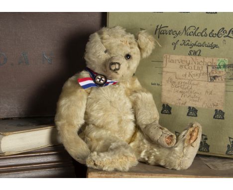 Benbow - a 1920s Farnell Teddy Bear, with blonde mohair, clear and black glass eye with remains of brown painted back, pronou