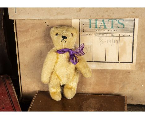 A small post-war Steiff Teddy Bear,  with golden mohair, brown and black glass eyes, pronounced muzzle, black stitched nose a