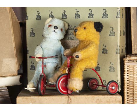Two post-war Teddy Bears on tricycles, Happy Wanderer, a Chad Valley blue synthetic plus example with seam label; and a Sooty
