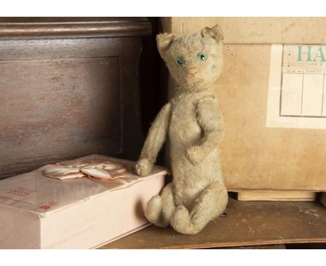 A Steiff pre-war head turning Kitty cats, with striped white mohair, clear and black glass eyes with green backs, pink stitch