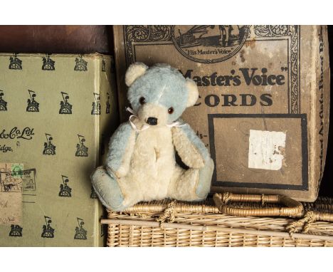 A Chad Valley blue and white wool plush Cubby Bear 1950s, with orange and black glass eyes, black stitched nose and mouth, sw