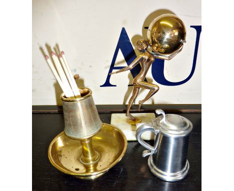 Dunhill tankard table lighter, a 'naked lady' advertising table lighter for World Famed Ingots, and a brass match striker