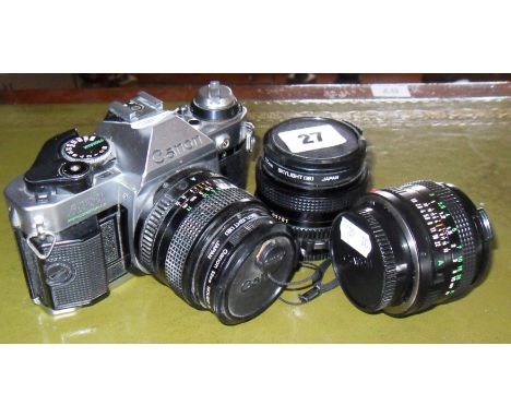 Canon AE-1 camera with two lenses