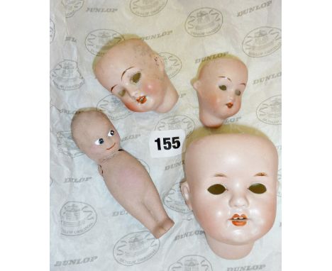 Three German bisque porcelain doll's heads and one china Kewpie doll (A/F)
