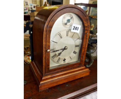 Dome-topped walnut mantle clock