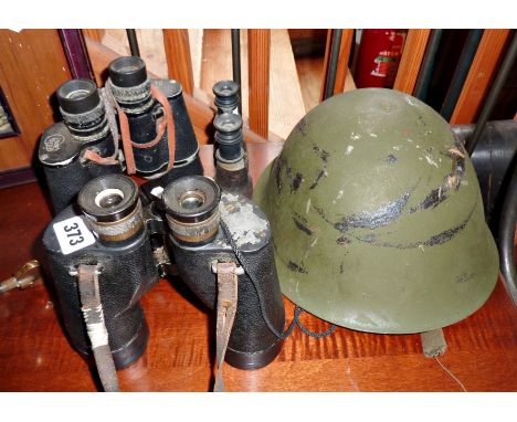 Three pairs of old binoculars (One WW2 marked REL CANADA 1944), a soldier's helmet with liner, and a Kodak Brownie camera