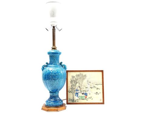 Blue glazed earthenware table lamp with fabric shade, China 20th century, 105 cm high and wall decoration on textile with dec