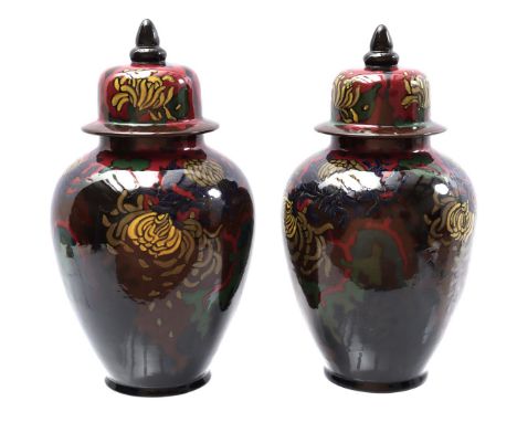 South Holland Gouda 2 pottery lidded pots model 1052, decor Chrysanthemums, 35 cm high (neck of 1 with damage)