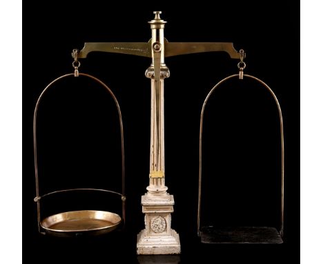 Brass scales on iron light lacquered column, marked on plate Gesetzlich Schützt, 63 cm high, 52 cm wide