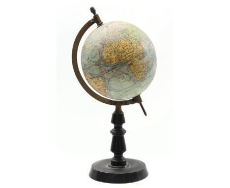 Earth globe, marked Globe Terrestre J Forest, on black lacquered wooden base, ca. 1920, 36 cm high