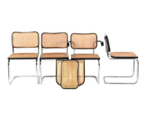 3 chrome dining room chairs with webbing back and seat and 1 chair with armrests with blackened wooden frame and armrests in 