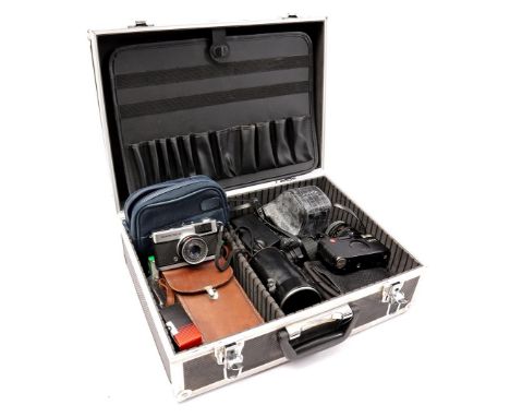 Metal case with various cameras including antique Kodak folding camera in leather bag, Leica minilux, FujicaST801, Olympus Tr