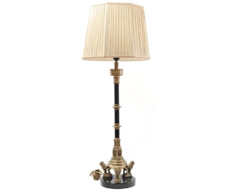 Classic brass table lamp with blackened parts, lions at the base and upholstered shade, on a stone base, 100 cm high