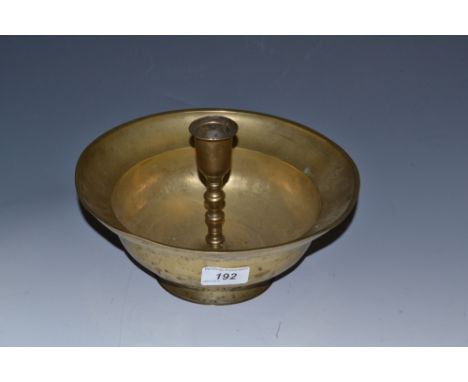 A 19th century Middle Eastern brass candlestick