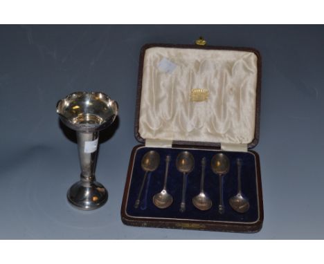 A set of six George V silver tea spoons, Sheffield 1922;  a bud vase with weighted base Sheffield 1968 (2)