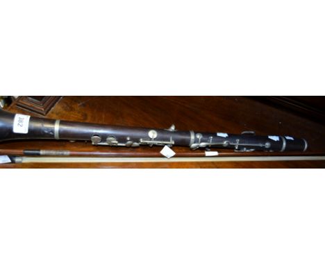 Musical Instruments - an Excelsior clarinet, retailed by Riviere and Hawkes, Leicester Square, London; violin bow (2)